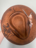Load image into Gallery viewer, Overhead view of brown Floral art on the flatrbrim hat.