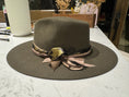Load image into Gallery viewer, Olive green Flatbrim hat with green leopard silk ribbon , brown gold cord and tan silks tied in the perfect bow. Hat bar at Private event.